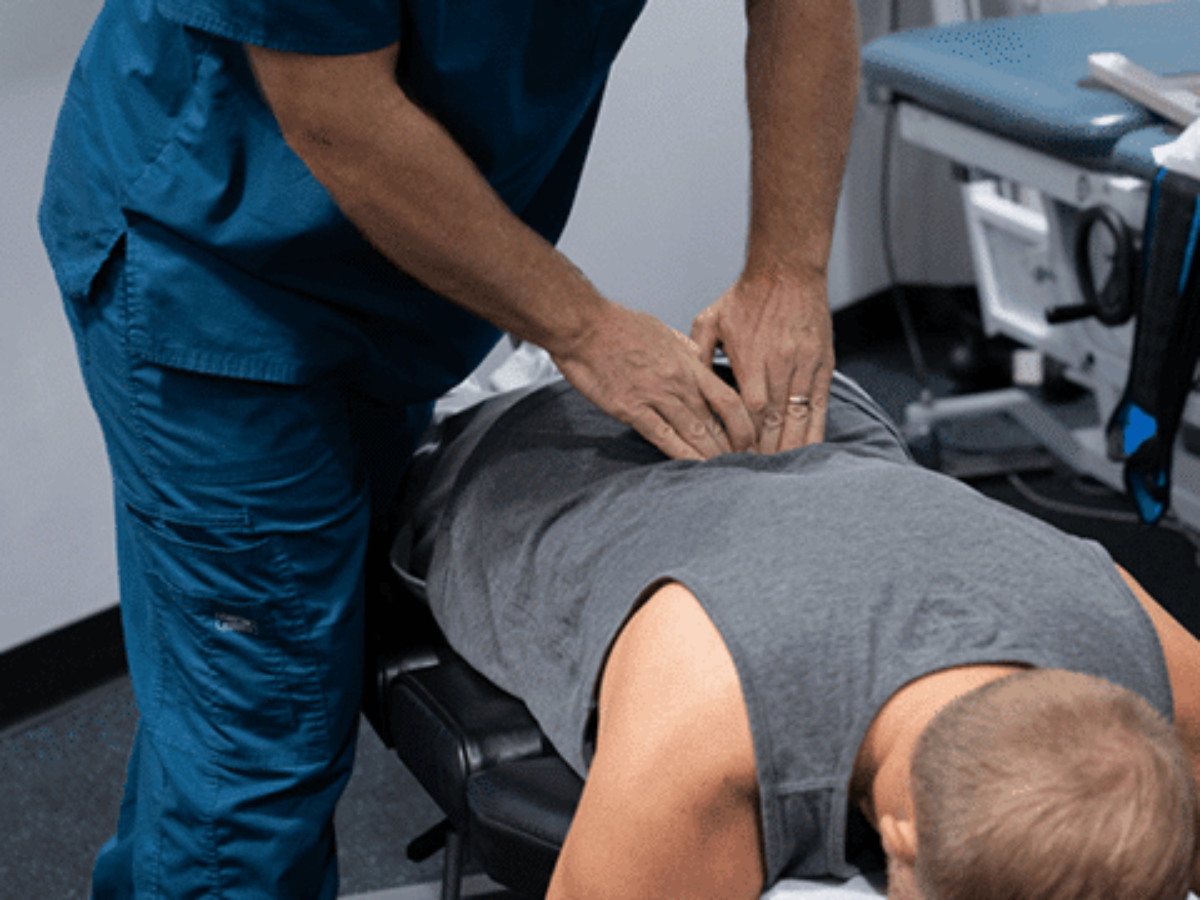 Chiropractor providing back treatment
