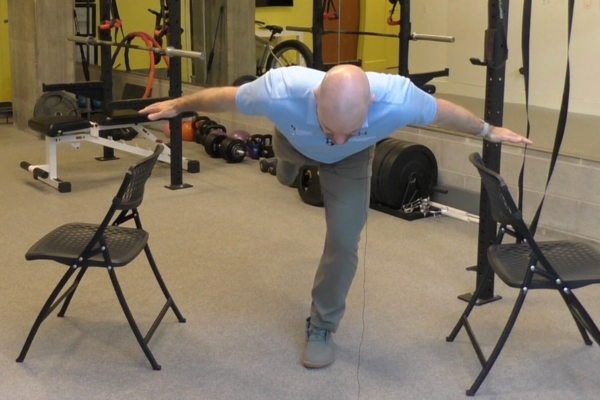 Craig Fitzpatrick demonstrates the Hip Airplane exercise.